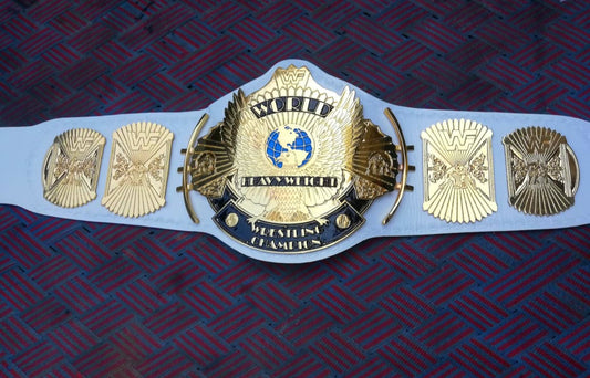winged eagle championship belt on a dark blue background
