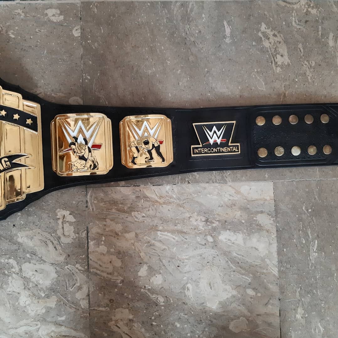 WWE championship belt on a stone floor